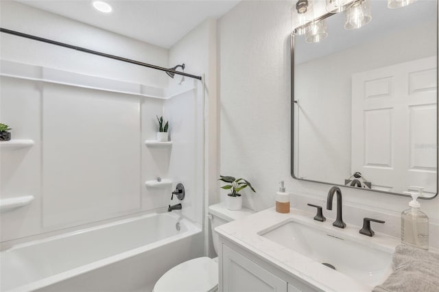 full bathroom featuring toilet, vanity, and bathtub / shower combination