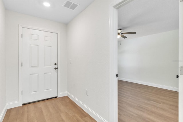 interior space featuring ceiling fan and light wood-type flooring