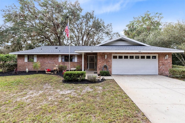 ranch-style house with a front lawn and a garage