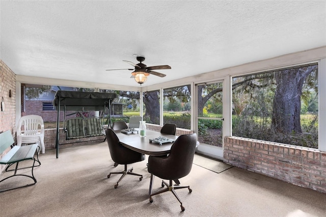 sunroom / solarium with ceiling fan