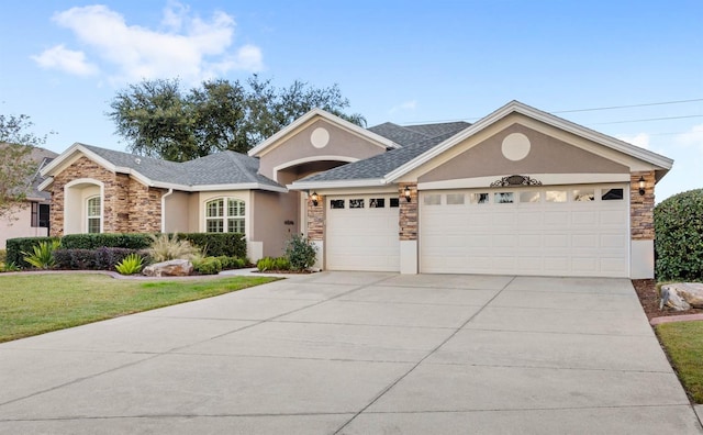 ranch-style home with a garage and a front lawn