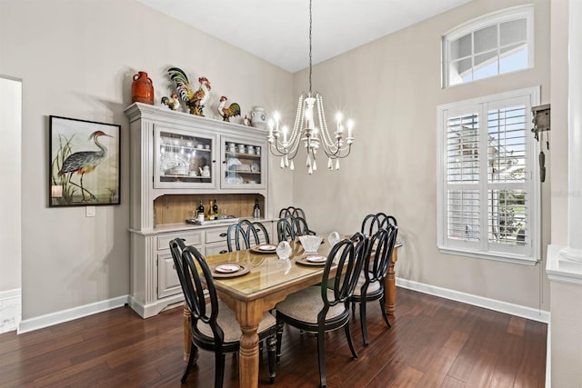 dining room with a chandelier and dark wood-type flooring