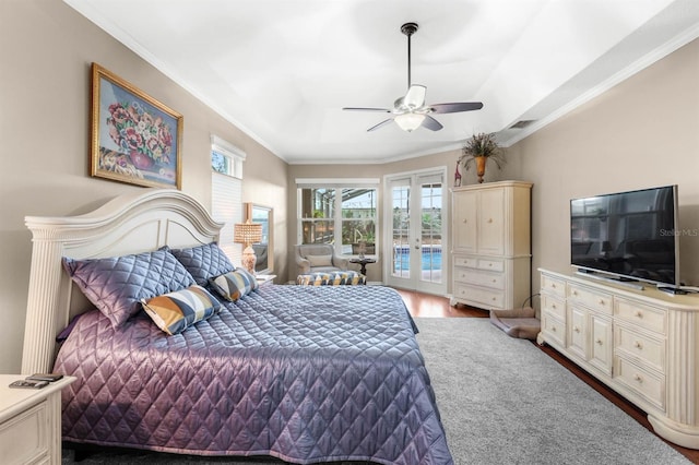 bedroom featuring ceiling fan, wood-type flooring, crown molding, and access to outside