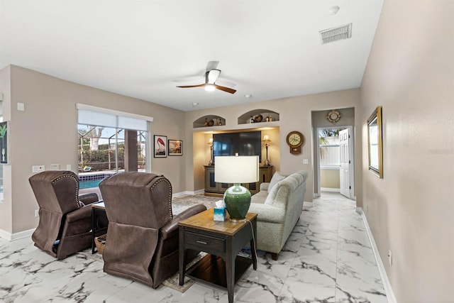 living room featuring ceiling fan