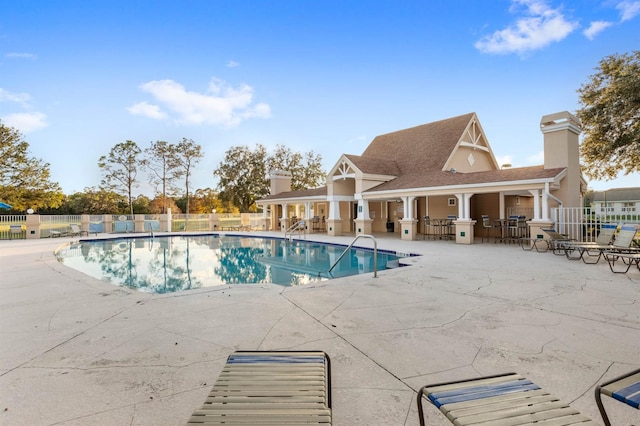 view of swimming pool with a patio