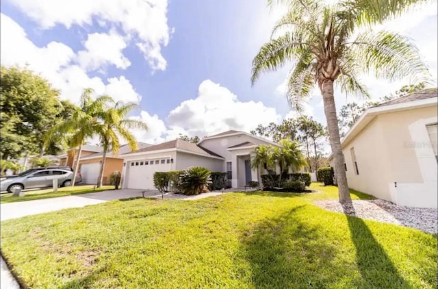 view of front of home with a front lawn and a garage