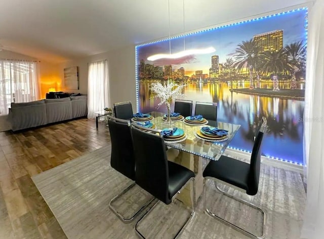 dining space featuring wood-type flooring