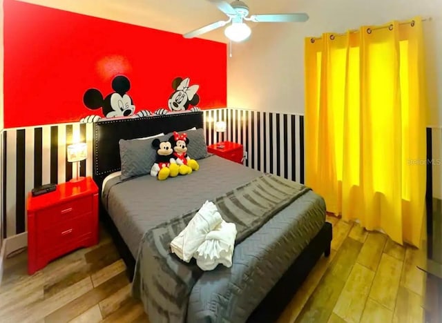 bedroom featuring hardwood / wood-style floors and ceiling fan