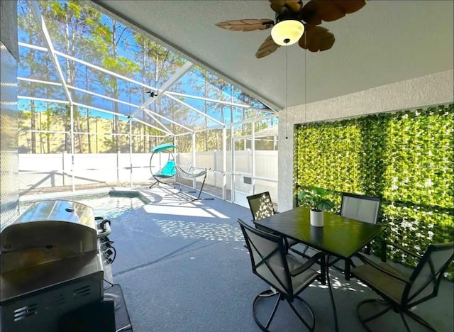 sunroom / solarium featuring ceiling fan, a swimming pool, and vaulted ceiling