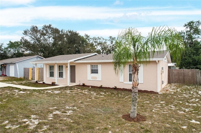 ranch-style house featuring a front lawn