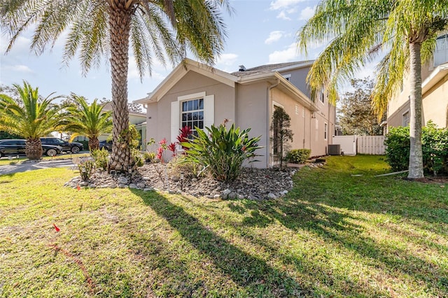 view of home's exterior with a yard