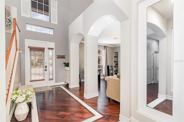 entryway featuring dark hardwood / wood-style floors and crown molding