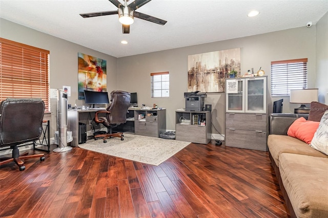 office featuring ceiling fan, dark hardwood / wood-style flooring, and a textured ceiling