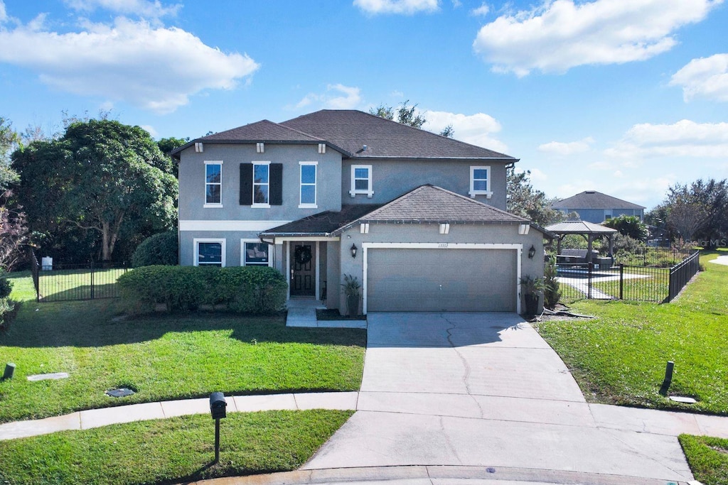 front of property featuring a gazebo and a front yard