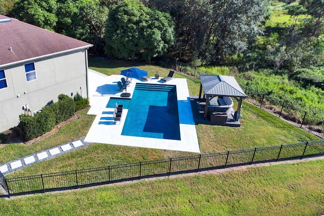 view of swimming pool featuring a gazebo and a yard