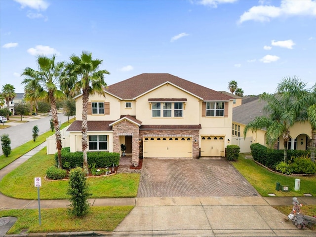 view of front of house featuring a front yard and a garage