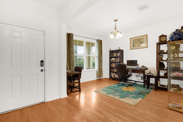 office featuring hardwood / wood-style floors and a notable chandelier