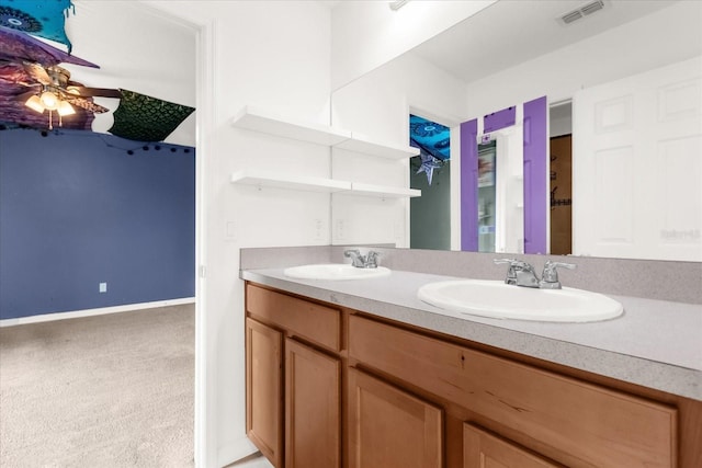 bathroom with ceiling fan and vanity