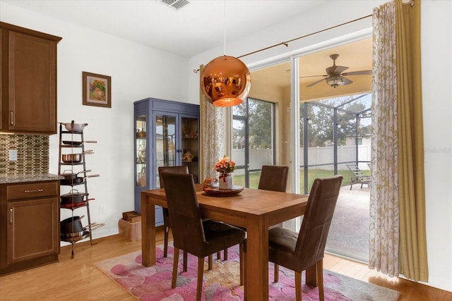 dining room featuring ceiling fan and light hardwood / wood-style flooring