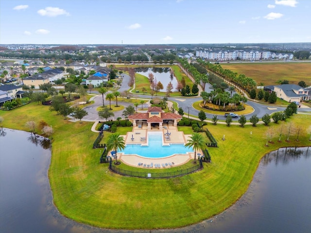 birds eye view of property featuring a water view