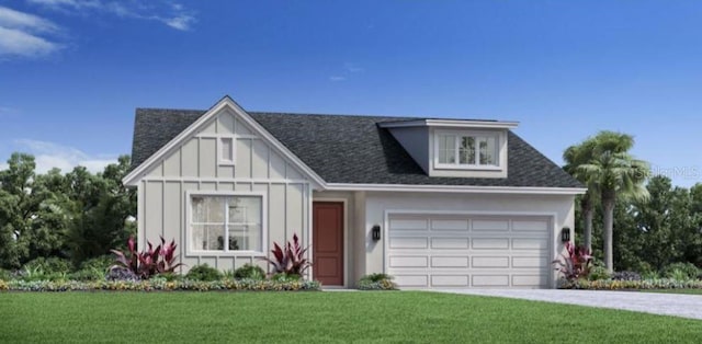 view of front of property featuring a front yard and a garage