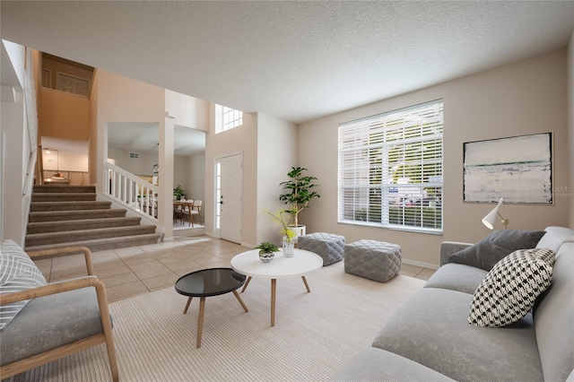 tiled living room with a textured ceiling