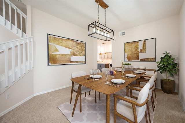 carpeted dining area with a notable chandelier