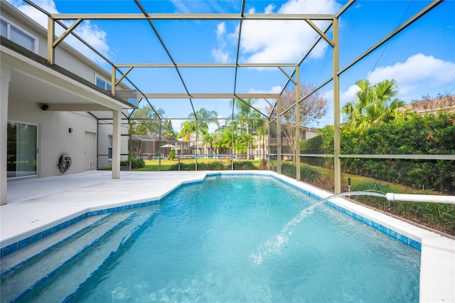 view of pool featuring a patio, pool water feature, and a lanai