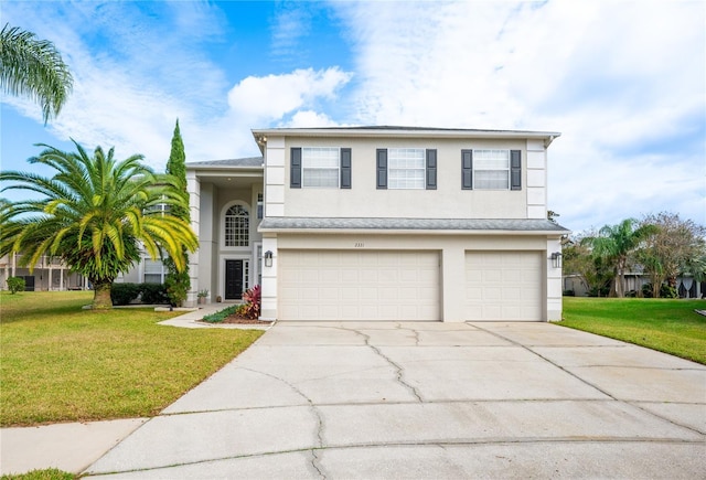 view of front of house featuring a garage and a front lawn