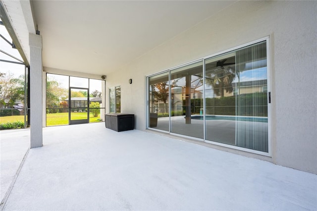 view of patio with a lanai