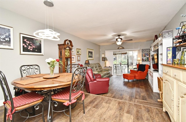 dining space with dark hardwood / wood-style flooring and ceiling fan