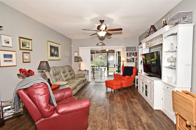 living room featuring ceiling fan and dark hardwood / wood-style flooring