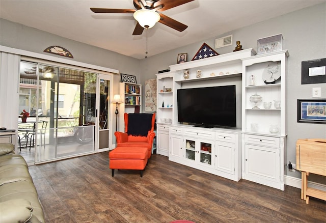 living room with dark hardwood / wood-style flooring and ceiling fan