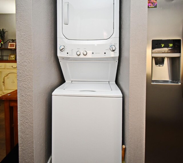 washroom with stacked washer and clothes dryer