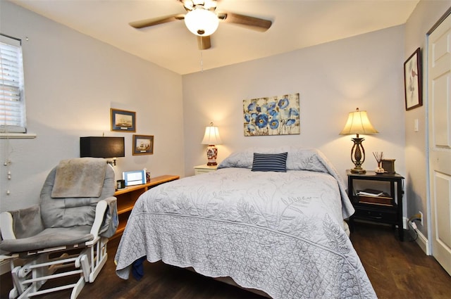 bedroom with ceiling fan and dark hardwood / wood-style flooring