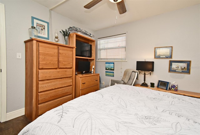 bedroom featuring ceiling fan and dark wood-type flooring