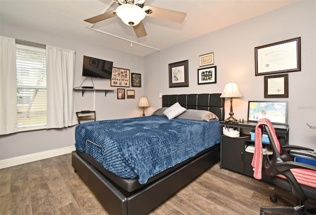 bedroom featuring ceiling fan and wood-type flooring