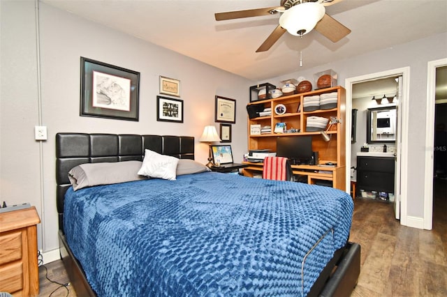 bedroom with ensuite bath, ceiling fan, and dark wood-type flooring