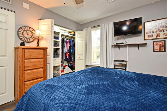 bedroom with ceiling fan and a closet