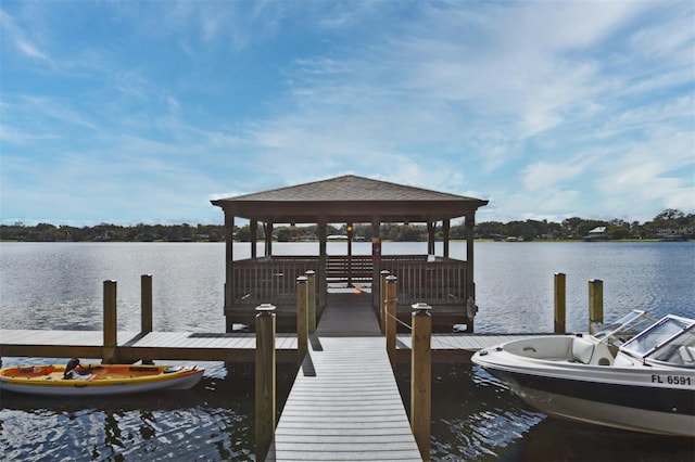 dock area featuring a gazebo and a water view