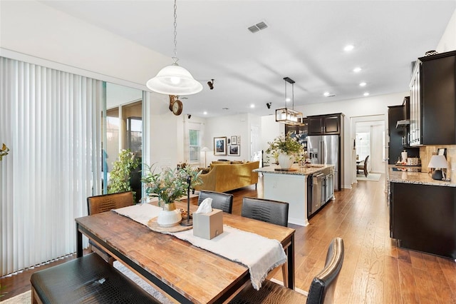 dining area with light wood-type flooring