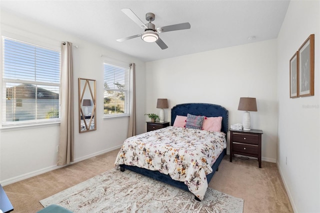 bedroom featuring ceiling fan and light colored carpet