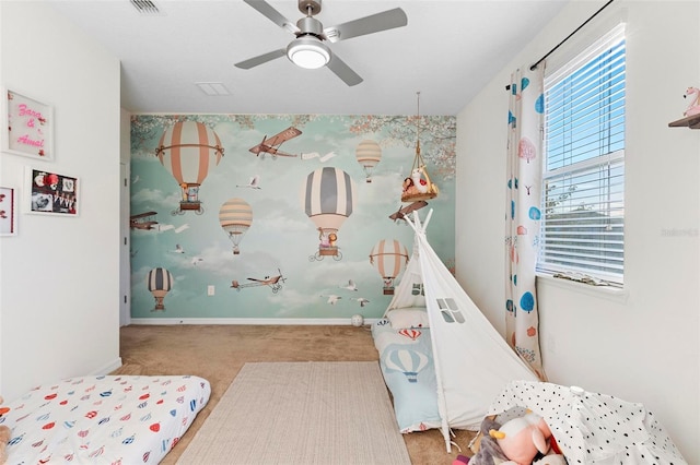 bedroom featuring ceiling fan and light carpet