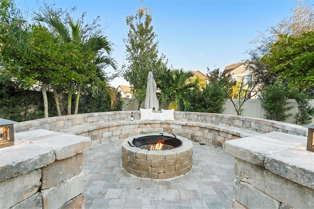 view of patio with a fire pit