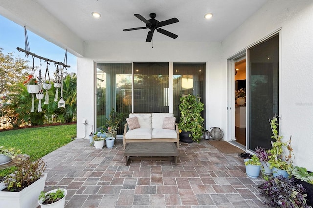 view of patio / terrace featuring ceiling fan