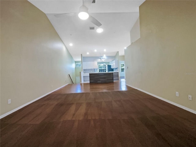 6629 Pineview Ter Unit 5-201, Bradenton, FL 34203 - unfurnished living room featuring ceiling fan, lofted ceiling, and carpet