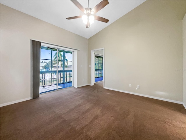 empty room with ceiling fan, high vaulted ceiling, and dark carpet