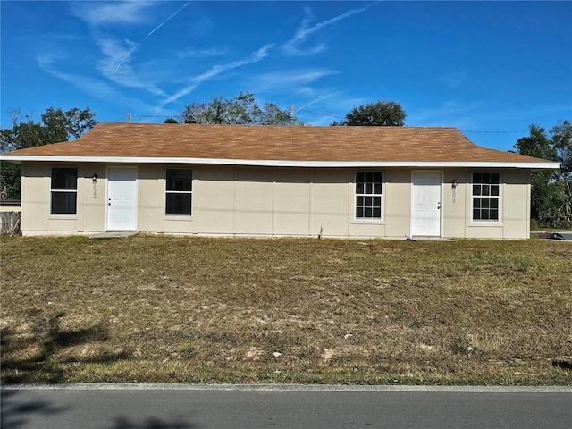 ranch-style house with a front yard