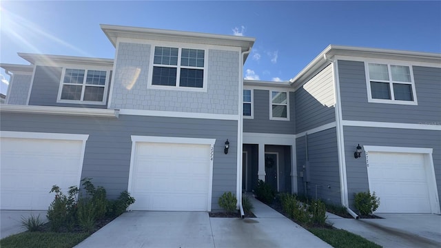 2774 Bright Bird Ln, Winter Park, FL 32792 - townhome / multi-family property with a garage