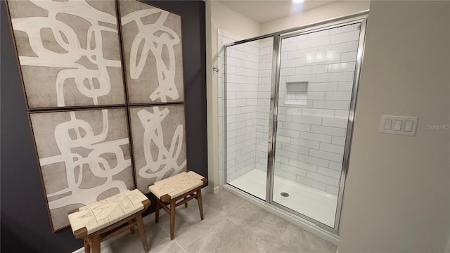 bathroom with a shower with shower door